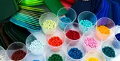 display of different coloured plastics pellet and card samples (source: http://www.istockphoto.com)