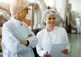 food workers discuss options in a production facility
