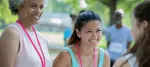 two race organizers greeting a participant