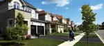 mother pushing a stroller in a residential community in Brantford