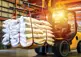 front end loader moves bags of raw food materials